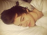 Wakey wakey: An intimate snap of Harry Styles posing in bed with just one eye open was posted on Twitter