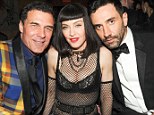 Material girl: Madonna, sat between Andre Balazs and Riccardo Tisci, unveiled her daring punk outfit at the Costume Institute Gala After Party at the BOOM BOOM Room in New York, on Monday