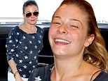 What a difference a pair of shades make! LeAnn Rimes shows off her make-up free face as she arrives in Toronto