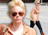 Bouffant blunder! Rose McGowan steps out in a voluminous updo that falls flat by the end of the day