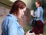 It must be dirty work! Christina Hendricks emerges from her trailer with wet hair and no make-up after filming with Ryan Gosling