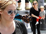 Slimming shade: Hilary Duff opted for an all-black ensemble on Wednesday as she took her boy Luca out in Beverly Hills, California