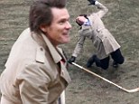 He's fallen and he can't get up! Jim Carrey collapses with a hockey stick while filming scenes for Anchorman sequel in Atlanta