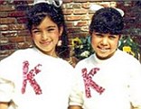 Before they were famous: Kim Kardashian strikes a pose while Kourtney is more demure in childhood snap 
