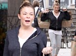 Work out anywhere! Fitness fanatic LeAnn Rimes exercises with heavy shopping bags as she leaves Whole Foods with some healthy dinner