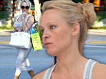 Striped beauty: Pamela Anderson wore a grey and white striped sundress on Saturday while out in Malibu