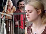 Elle Fanning and Peter Dinklage hang out on fire escape while shooting their film, Low Down