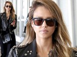 Rocker chick: Jessica Alba arrived at Los Angeles International Airport on Friday dressed in an all-black ensemble