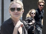 Putting a smile on her face! Ashley Olsen can't help but grin on shopping trip with a mystery man