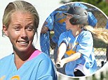 Blonde at bat: Kendra Wilkinson took a cut at the plate on Saturday during a softball game in Los Angeles with husband Hank Baskett