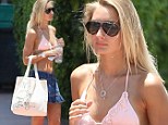 That will make them drool! Model Petra Benova struts her tanned and toned body in pastel bikini top and tiny denim skirt