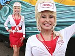 Ageless beauty: Dolly Parton, 67, revealed her stunning figure in a form-fitting red dress for Homecoming Weekend at Dollywood, in Tennessee, on Friday
