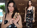 C'est dlicieuse! Liv Tyler is in the mood for ice cream as she serves up the treat at Cannes