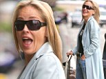 High on life! A giddy Sharon Stone, 55, shows off her laugh lines as she flashes a smile at the Los Angeles airport
