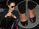 That's much better! Kim Kardashian gives her swollen feet a rest as she FINALLY ditches the heels in favour of flats