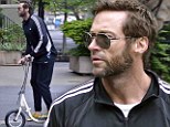 Wolverine doesn't walk: Hugh Jackman cruises around NYC on a scooter