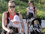 That's what you call multi-tasking: Guy Ritchie's fiancee Jacqui Ainsley balances her son and daughter