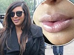 'My pregnancy lips are outta control!' Kim Kardashian shares a picture of her plumped-up pout