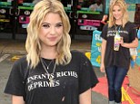 You could have made an effort! Ashley Benson is dishevelled in holey T-shirt and jeans as she sips Slurpees at 7-Eleven event