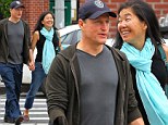 Smiling games: A cheerful Woody Harrelson walks hand in hand with his wife in New York