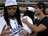 True bromance! Taylor Lautner and Lil Jon hug it out together at baseball game