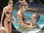 Cold champagne and a sexy bikini body! Victoria's Secret model Candice Swanepoel frolics in the pool with her hunky Brazilian boyfriend