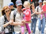 Enchanted by our girl! Amy Adams and her fianc dote over daughter on a fun day out