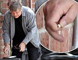 A series of images clearly show the veteran actor rummaging through the public ashtray outside a Los Angeles recording studio on Thursday.