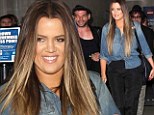 Keeping Up With The Chic! Khloe Kardashian continues her fashion trend as she jets to LAX in slim black trousers and denim blouse