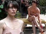 Milla Jovovich goes braless in flesh-coloured negligee for performance piece at Venice art festival 