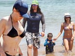 It's their show now! Max Greenfield and Steve Howey cover up as their wives parade their bikini bodies on the beach in Hawaii