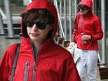 Ready for rain: Anne Hathaway wore a waterproof coat as she stepped out on a gloomy day in NYC with her husband Adam Shulman on Friday