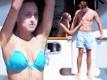 Arnold Schwarzenegger's son Patrick gets some attention from his girlfriendTaylor Burns in St Tropez