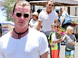 Spoiling mom on dad's day? Gavin Rossdale enjoys a sunny day out with his sons on Father's Day as they pick up a bouquet of flowers at the Farmer's Market... for Gwen?