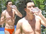 Jerry O'Connell displays his very slender frame in skimpy orange Speedo on the set of new television show We Are Men 