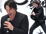 The Matrix reloaded! Keanu Reeves screams down a microphone and demonstrates intense Kung Fu moves at press conference for new film