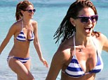 Showing her true colours! Maria Menounos dons a Greek flag string bikini for a dip in the sea on the island of Mykonos