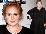 A sight for sore eyes! Adele sports dramatic make-up and braided updo as she makes a rare public appearance at music industry lunch 