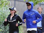 The couple that works out together... Scarlett Johansson and boyfriend Romain Dauric looked perfectly in sync as they jogged around Paris, France, over the weekend