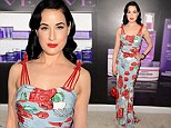 A rose by any other name: Dita Von Teese shows off her perfect hourglass figure in fitted floral frock