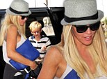 Incognito: Model Jenny McCarthy flew out of Los Angeles with her son Sunday wearing a hat and dark glasses 