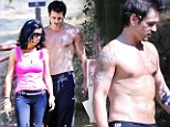 Toned and tattooed hunk Colin Farrell ditches his shirt to go hiking in Beverly Hills with a mystery brunette