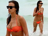 Who needs a catwalk? Irina Shayk brings the heat to Miami's Swim Week while going for a quick dip in a cheeky bikini