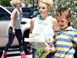 Oops, she did it again! Britney Spears misfires in high top wedge trainers and lace blouse as she takes her sons to lunch