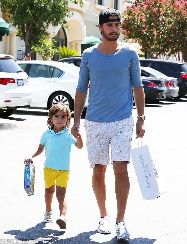 Just like Dad: Scott Disick and his three-year-old son Mason both wore blue T-shirts for a shopping trip to Barnes & Noble for toy lego in Los Angeles on Tuesday 