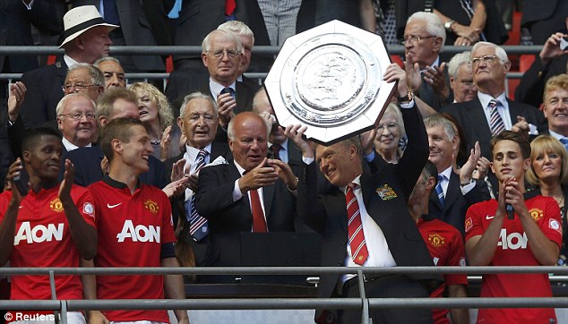 First of many? David Moyes holds aloft the Community Shield - his first trophy at Manchester United