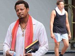 No more Hustle, only Flow: Terrence Howard sports a tight tank... as he reads up on New Age spirituality following ex's restraining order for wife-beating