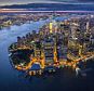Burning brightly: Aerial photographer Jason Hawkes has caught New York City in action many times of over the years. Here, Manhattan is seen at dusk from its southernmost tip