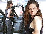 Bra-vo! Kristen Stewart flashes her lingerie as she heads into a restaurant with her dog