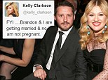 Amerian Idol Kelly Clarkson took to twitter to say she was not expecting her first child killing rumours which spread after she announced she was eloping with Brandon Blackstock
